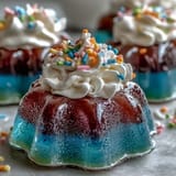 Vibrant Rainbow Jello Cups for Kids: A cheerful, multi-layered dessert with bright gelatin and creamy topping, fun for all ages.