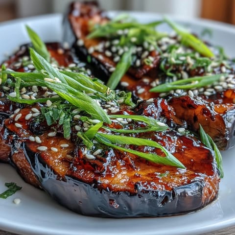 Miso glazed eggplant roasted until tender with caramelized edges, served warm as a savory Japanese side dish.